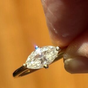 East west set prong set marquis moissanite. 10K solid YG Ring. Sz 8 sizable